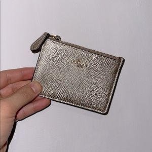 Shiny gold Coach Mini Skinny ID case & key pouch.